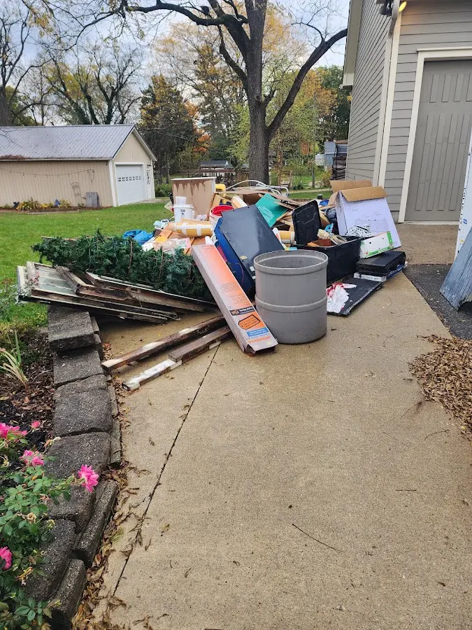 Dumpster being loaded with debris for Commercial Dumpster Rental in Mississippi State